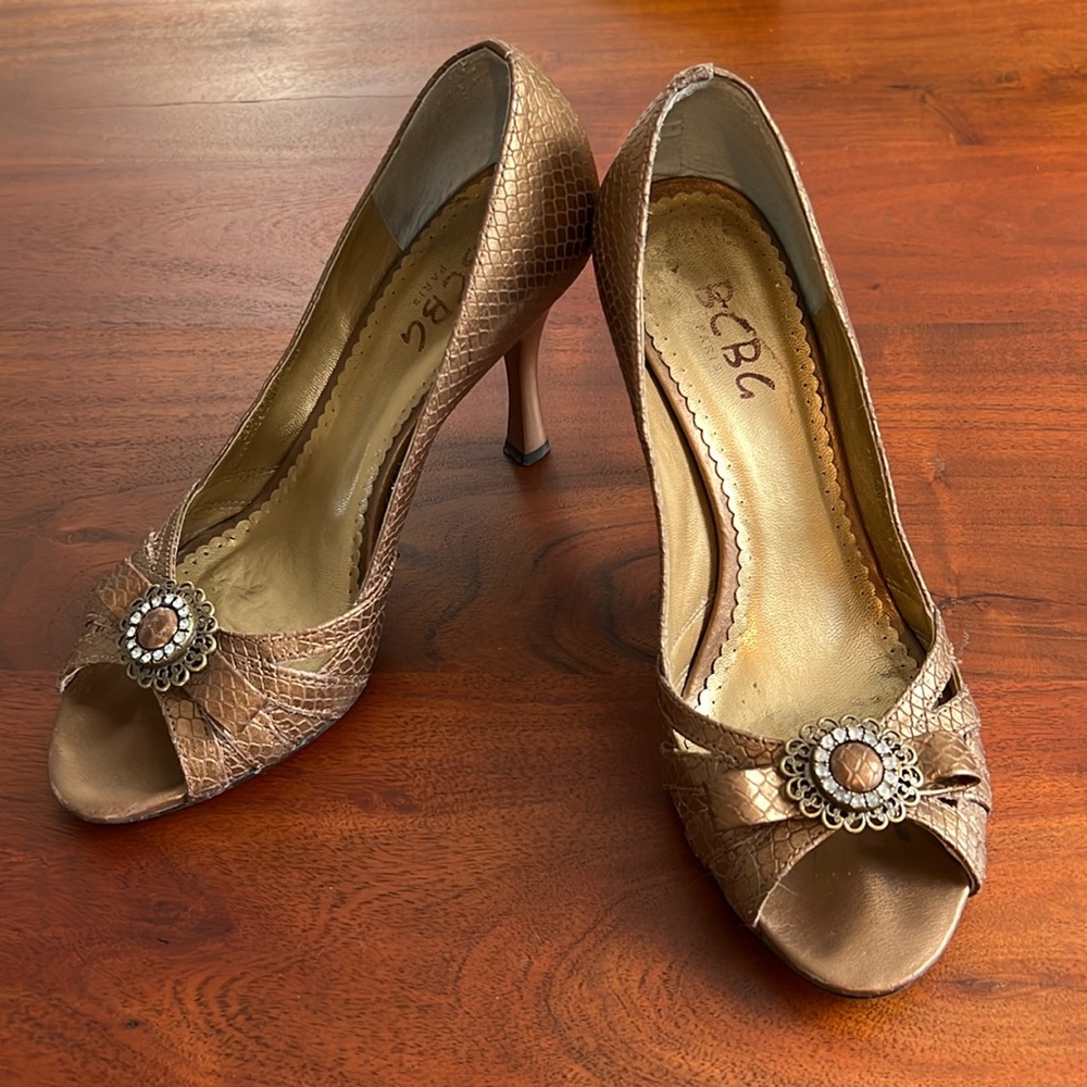 BCBG bronze peep toe heels with crystal detail.